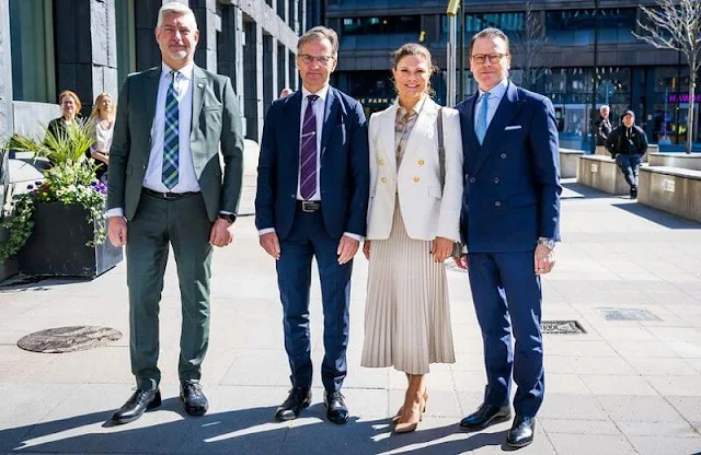 Crown Princess Victoria wore a new London white cross blazer by The Extreme Collection. VESNA W Meghan gold-beige silk blouse