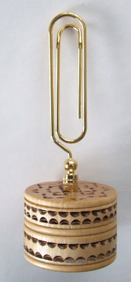 oversized paper clip memo holder, with hand-carved base