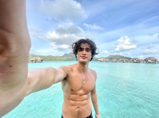 Picture of Charles Melton clicking a selfie
