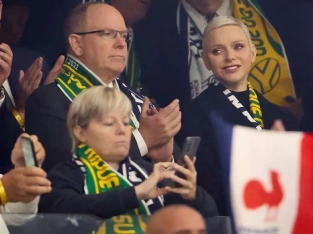 Princess Charlene wore a navy wool coat by Akris. Black leather trousers. France had not beaten South Africa since 2009