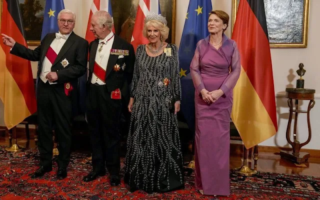 The Queen wore a black and silver gown by Bruce Oldfield. The Boucheron diamond Tiara and fringed diamond necklace