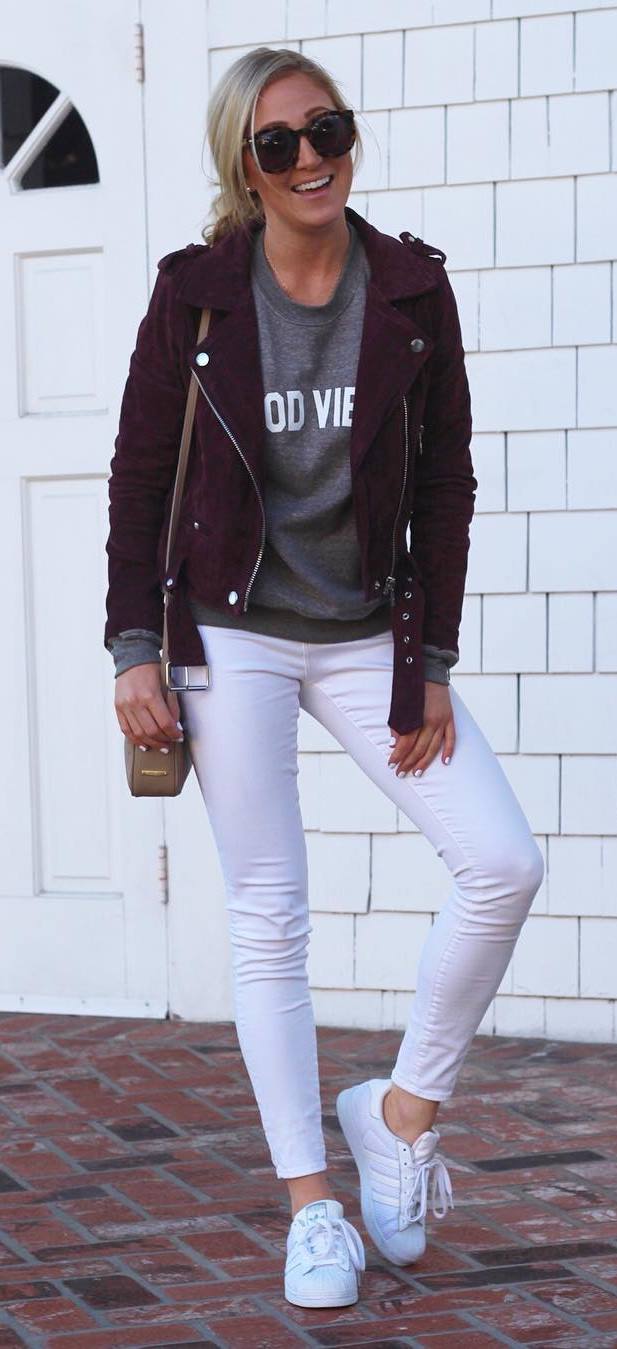 trendy fall outfit : maroom biker jacket + sweatshirt + white skinnies  + sneakers