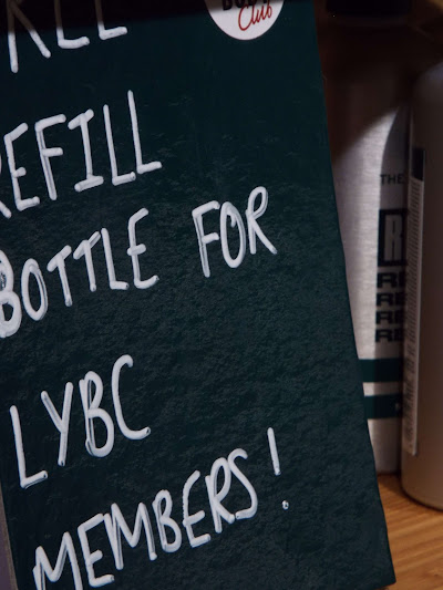 Small sign reading, free refill for LYBC members.