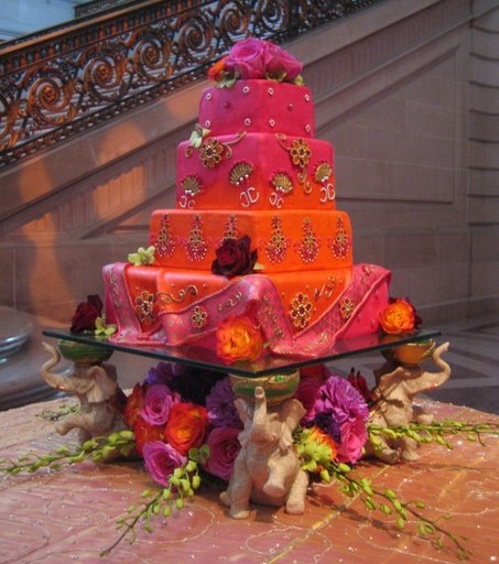 Three square orange and pink wedding cake ideas from Not Just Cheesecakes