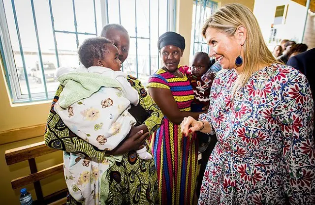 Queen Maxima wore an Axelle floral print maxi dress by Vanessa Seward x Bloom Paris. Queen Maxima wore slippers sandals