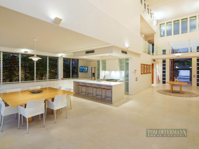 Photo of modern kitchen and dining room in beautiful waterfront villa