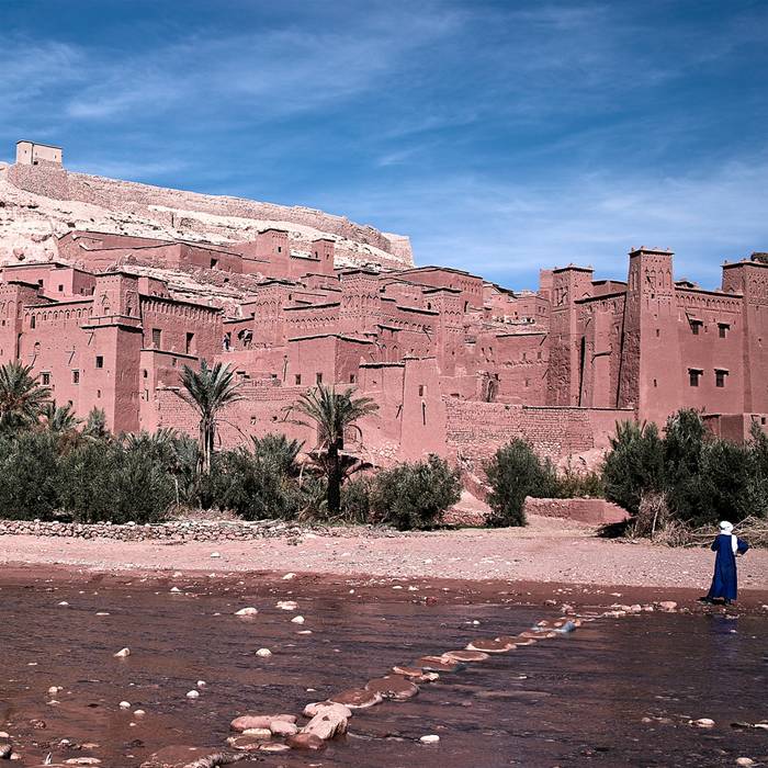 The Ksar of Aït-Ben-Haddou is a striking example of southern Moroccan architecture. The ksar is a mainly collective grouping of dwellings. Inside the defensive walls which are reinforced by angle towers and pierced with a baffle gate, houses crowd together - some modest, others resembling small urban castles with their high angle towers and upper sections decorated with motifs in clay brick - but there are also buildings and community areas.