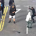Two Men Swing At Each Other With Machetes In Middle Of Road