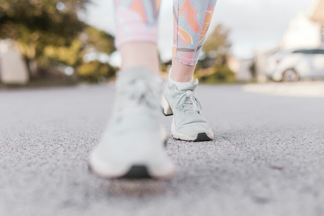 person in white sneakers