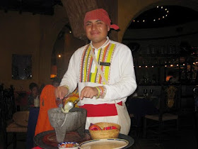 waiter making guacamole