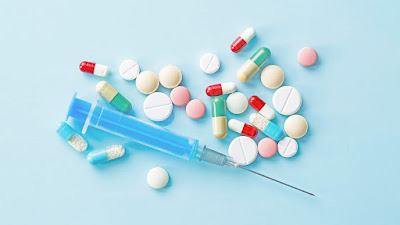 Image of medications and a syringe