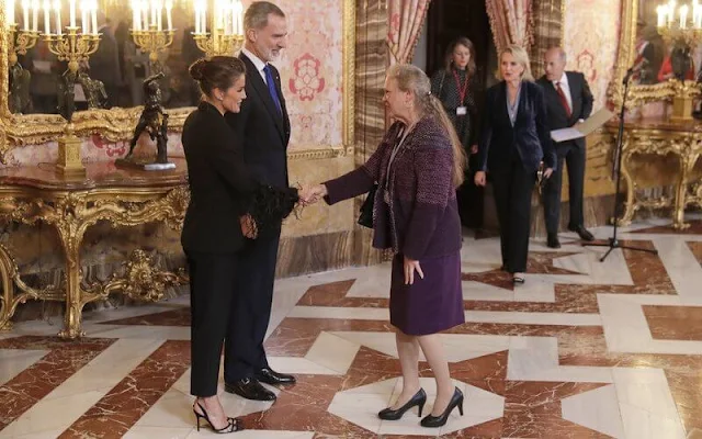 Queen Letizia wore a black fringed feather suit by Pertegaz. Chanel plume de chanel earrings, 18K white gold diamonds