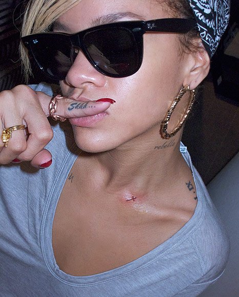 Rihanna Tattoo on Her Neck a Small Cross Photo The Hottest News