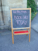 chalkboard. Text: "Feed the Minds. Booksale today."