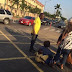 Woman backing a baby seen sitting in the middle of the road in Alausa