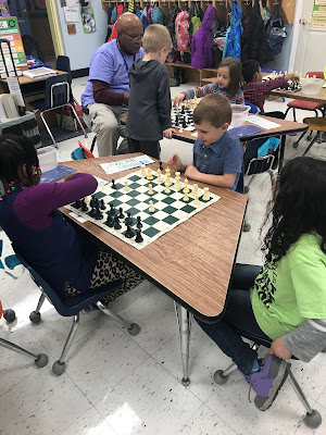 teacher teaching chess