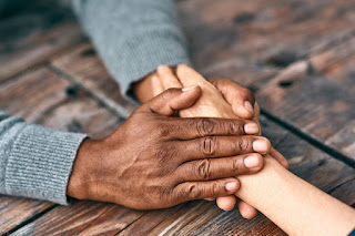 Supportive, holding hands