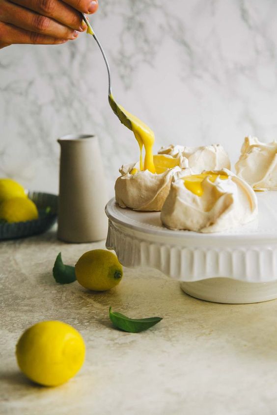 Pavlova with lemon curd. Such a beautiful dessert made with only five ingredients. Perfect Easter dessert, great for kids and adults. Made quickly and easy. Gluten-free recipe that's perfect for Mother's day or other celebrations. #pavlova #dessert