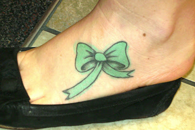 bow tattoos on foot