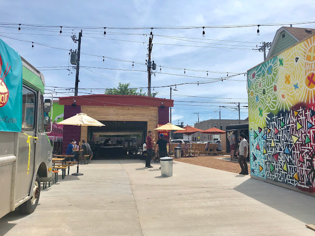 Murals and seating, along with a bar at the Zocalo Food Park