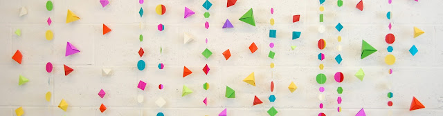 Sewn paper garland and origami triangle for Etsy Craft Party photo booth backdrop at Creative Outlet Studios