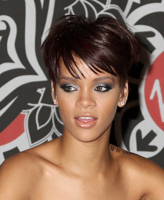 Rihanna is wearing a short hairstyle with bangs.