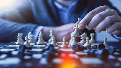 A man playing Chess game.