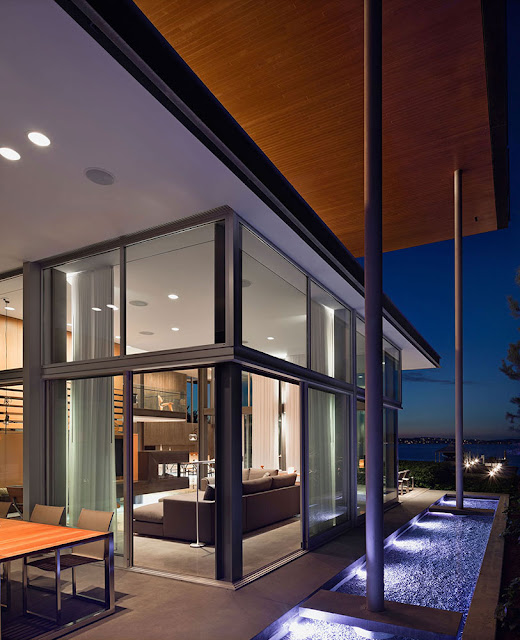 Picture of living room interiors as seen at night from the terrace