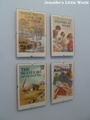 Ladybird book cover postcards on wall display