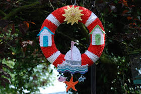 image of crocheted lifebuoy wreath with sea life themed motifs