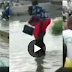Watch Viral Video Of Pedestrians Paying #50 To Be Carried On Back Across Flooded Road In Lagos (Video)