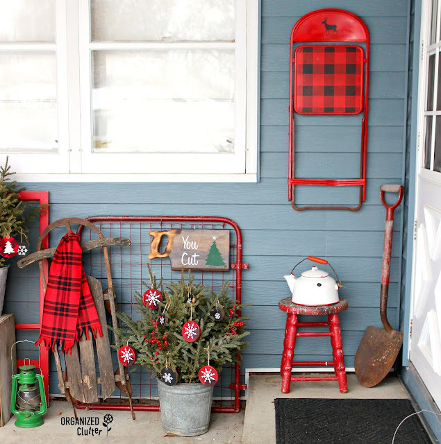 Photo of a junky Christmas covered front patio.