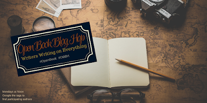 image of an old fashioned map with postcards and a magnifying glass lying atop. "Open book blog hop" logo.