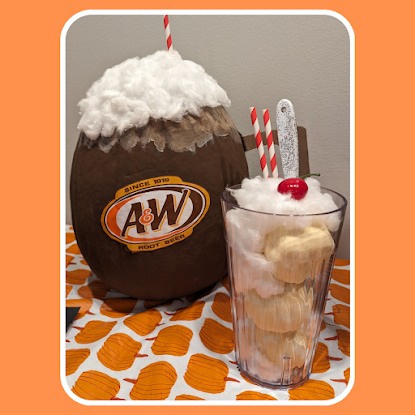 Pumpkin decorated as a root beer float