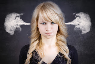 Woman so angry she is blowing smoke out her ears