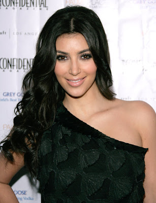 Kim Kardashian looks chic as ever in this black printed oneshouldered dress 