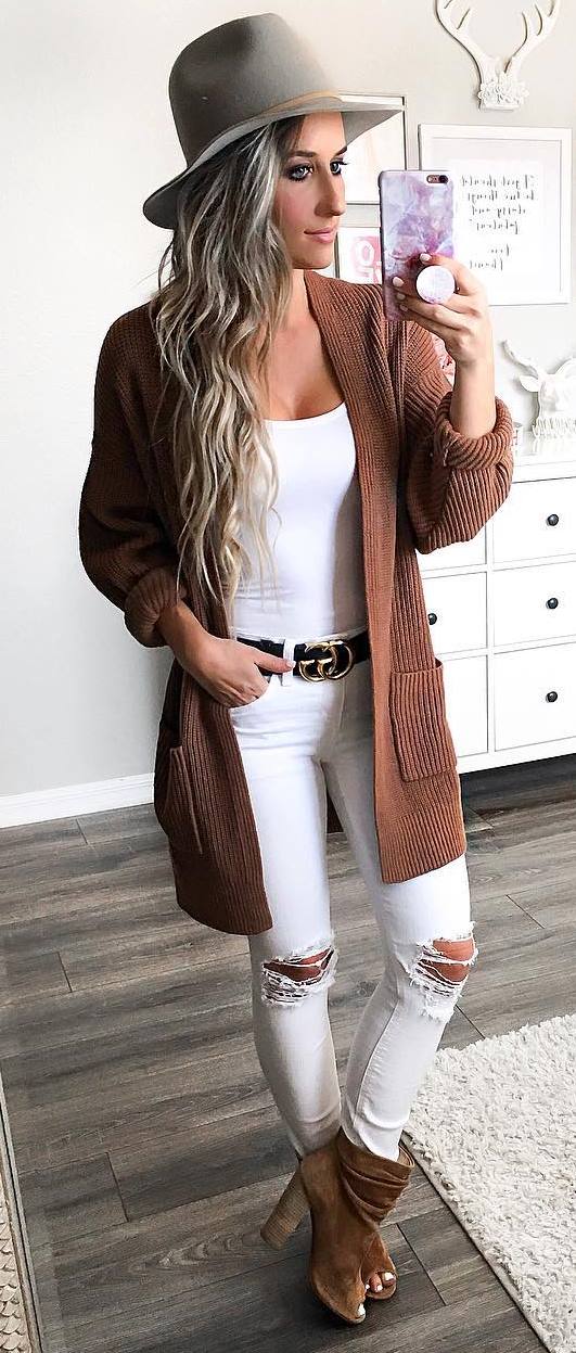 trendy fall outfit / hat + cardigan + white top + ripped jeans + boots