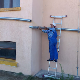 Bekir fixing a length of drain that fell down