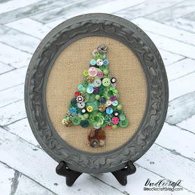 http://www.doodlecraftblog.com/2013/12/jeweled-button-christmas-tree-art.html#