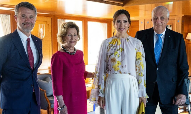 Crown Princess Mary wore a new cape-back floral-print silk-georgette blouse by Giambattista Valli. Rebekka Notkin