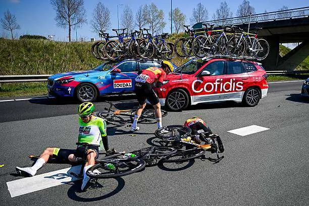Norway's Jonas Iversby Hvideberg of Uno-X Mobility (R) lies injured on the road with others following a crash during the men's race of the 113th edition of the Scheldeprijs, a 202.8 km one-day cycling event from Terneuzen, the Netherlands to Schoten, Belgium, on April 9, 2025. Photo by Tom Goyvaerts/Belga.