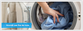 putting laundry in a washing machine