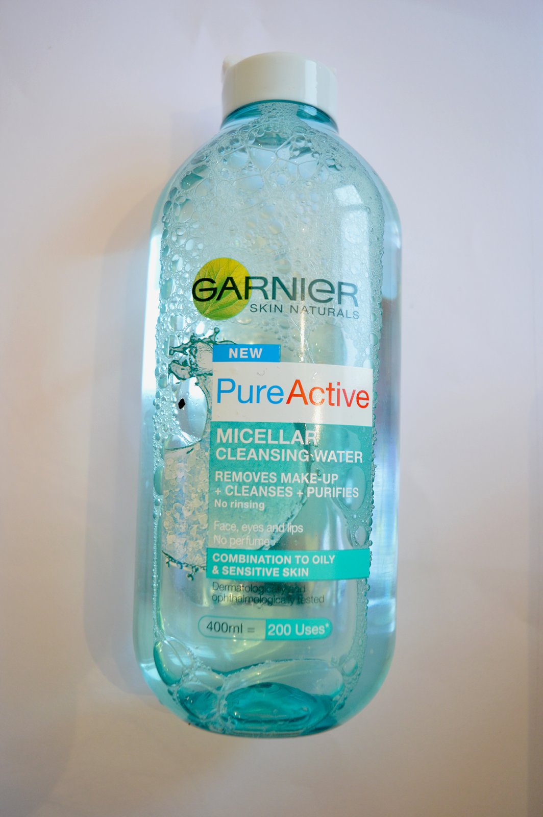 cleansing water by garnier, pure active, blue, bottle on a white background