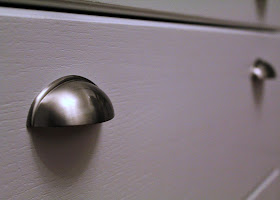 nickel plated cup pulls on white drawer