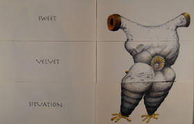 An open book. The lefthand page shows the text "Sweet Velvet Situation" and the right shows a white creature with yellow feet.