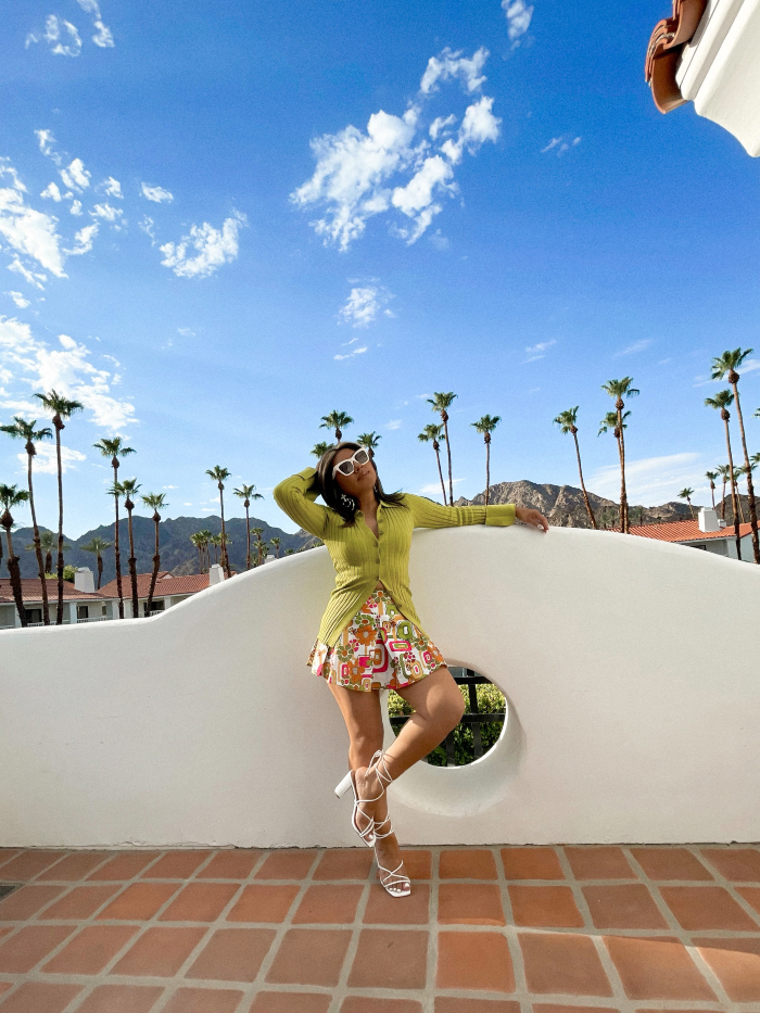 woman in palm springs wearing a printed skirt