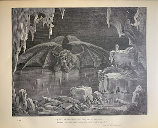 Lucifer, shown as a winged, horned giant, is trapped up to his waist in a lake of ice.