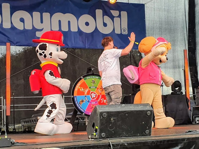 Image of the main stage at Gloworm Children's Festival 2021 featuring Skye and Marshall from Paw Patrol, alongside a presenter/host