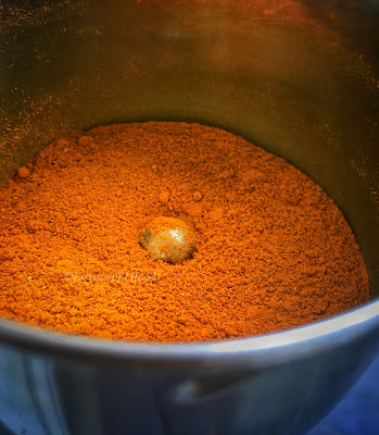 Finely ground turmeric powder in a mixer jar