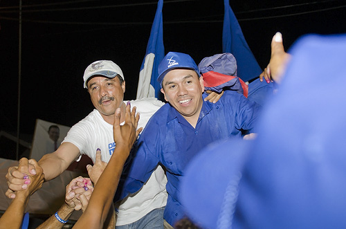 Dr. Marco Tulio Mendez (left) and Ex-UDP minister Marcel Cardona share the spoils of victory in Orange Walk East elections, March 7, 2012.